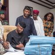 Acting President Yemi Osinbajo signing the 2017 appropriation bill on Monday, June 12, 2017 at the Presidential Villa in Aso Rock, Abuja