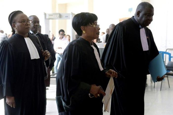 Jacqueline Moudeina (C) and Assane Dilma Ndiaye (R), lawyers of the plaintiffs in the case of former Chadian dictator Hissene Habre, arrive to the Appeal Court of the Extraordinary African Chambers (CAE) on April, 27, 2017 in Dakar