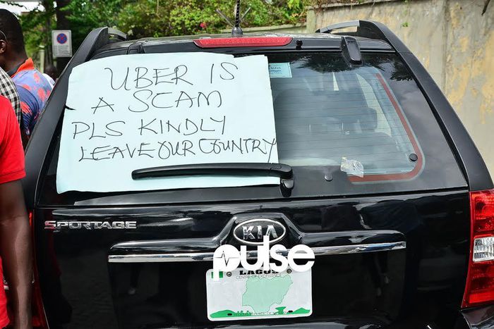 Uber drivers protest price cuts in Lagos.