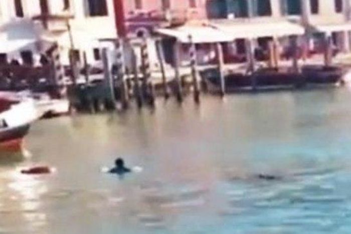 The African immigrant in Grand Canal in Venice