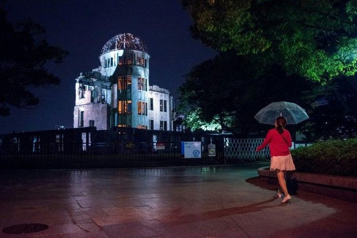 A pedestrian walks past the Hiroshima Peace Memorial Genbaku Dome on May 24, 2016