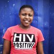 Nandi Makhele, poses for a portrait while wearing a T-shirt indicating that she is HIV-positive, in Cape Town's Khayelitsha township, file.  REUTERS/Finbarr O'Reilly