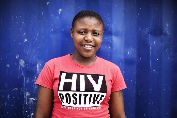 Nandi Makhele, poses for a portrait while wearing a T-shirt indicating that she is HIV-positive, in Cape Town's Khayelitsha township, file.  REUTERS/Finbarr O'Reilly