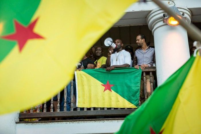 Representatives of the collective "500 freres" announce to a cheering crowd the signing of an agreement with the government in Cayenne, French Guiana on April 21, 2017