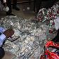 EFCC official sweats it out while counting cash hid in an Ikoyi apartment