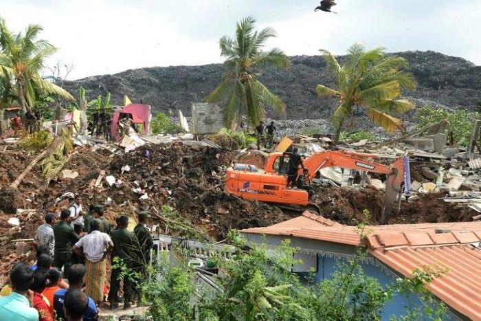 Sri Lankan rescue workers at site of collapsed garbage dump in Colombo on April 15, 2017