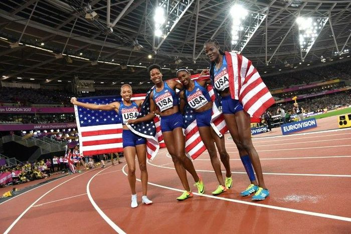 US athletes Quanera Hayes, Allyson Felix, Shakima Wimbley and Phyllis Francis celebrate winning the final of the women's 4x400m relay athletics event at the 2017 IAAF World Championships at the London Stadium in London on August 13, 2017