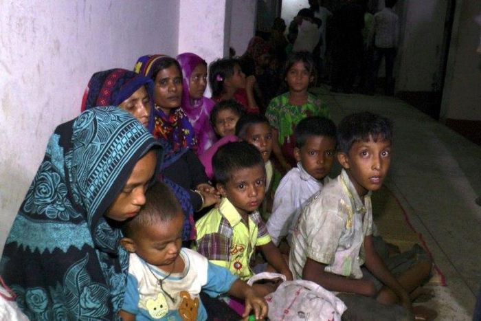 Bangladeshi villagers gather in a cyclone shelter after being evacuated from coastal villages in the Cox's Bazar district as Cyclone Mora approaches the country