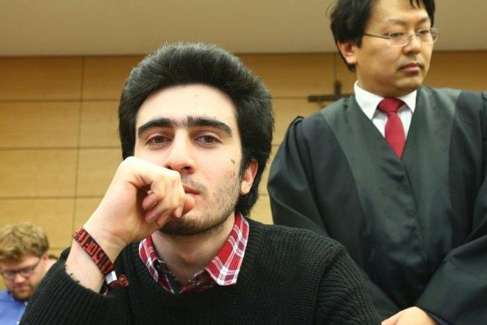 Syrian refugee Anas Modamani (left) and his lawyer Chan-jo Jun, had demanded that Facebook actively search out and take down all slanderous posts using the famous selfie he took with Chancellor Angela Merkel