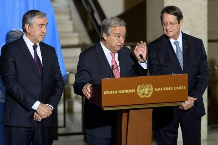 UN Secretary-General Antonio Guterres (C), pictured in January 2017, has arranged for rival Cypriot leaders, Turkish Mustafa Akinci (L) and Greek Cypriot President Nicos Anastasiades (R), to meet in New York this weekend