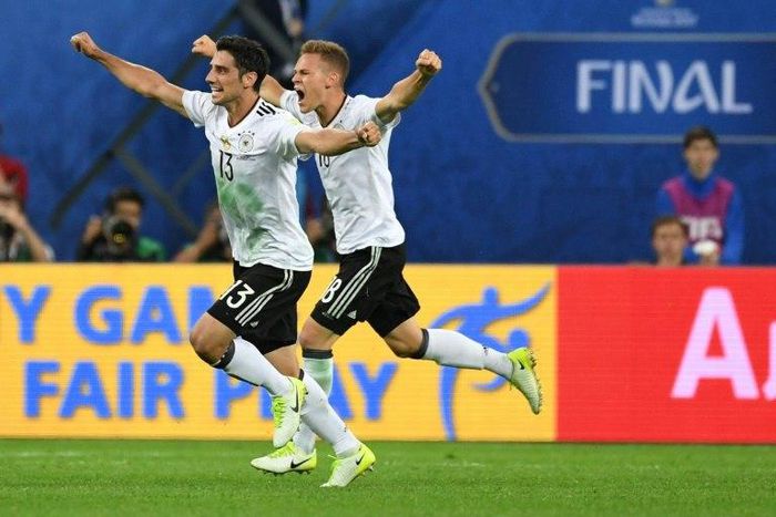 Germany's midfielder Lars Stindl (L) and defender Joshua Kimmich celebrate winning the Confederations Cup final on July 2, 2017
