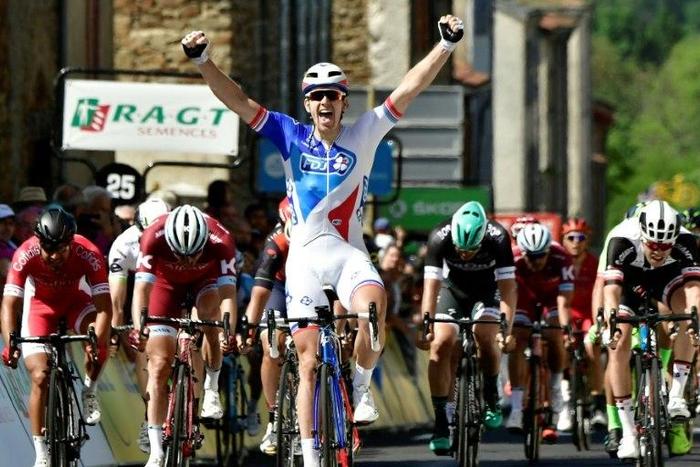 France's Arnaud Demare celebrates as he crosses the finish line at the second stage of the Criterium du Dauphine on June 5, 2017