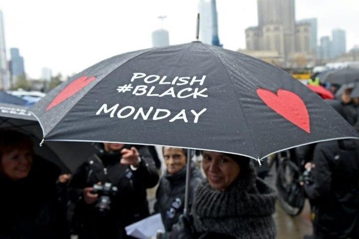 A woman raises her umbrella as a symbol of their protest, as thousands of women launched another round of protests against efforts to tighten Poland's abortion law on October 24, 2016