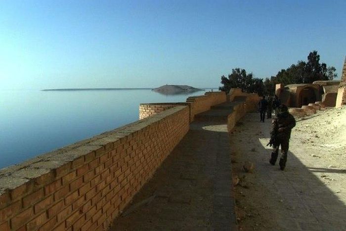 Fighters patrol a citadel on the edge of Lake Assad, behind the Tabqa dam west of Raqa, northern Syria, in a screengrab captured on March 5, 2017 from an AFPTV video filmed on February 26, 2017