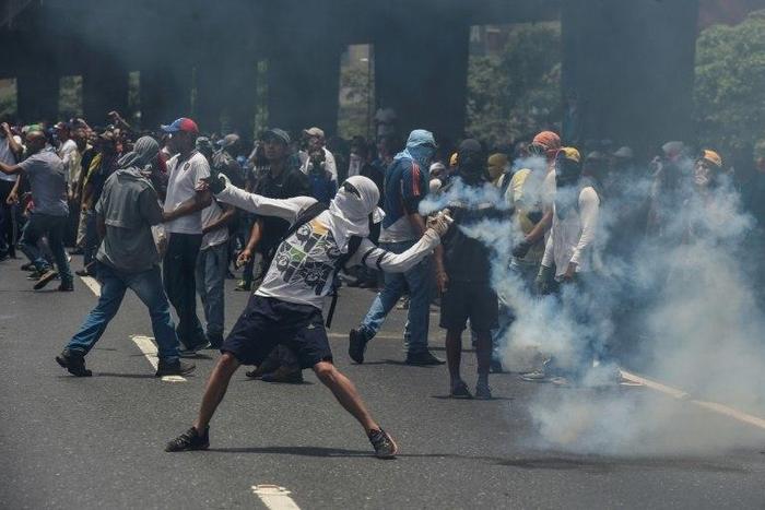 Marchers in Caracas were forced back by lines of soldiers and police deployed to contain what the opposition vowed would be the "mother of all protests"