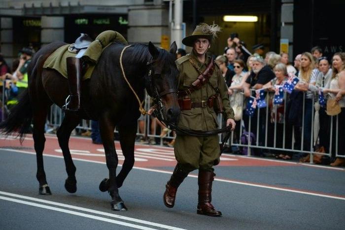 An Australian soldier walks with his horse in the Anzac Day parade in Sydney on April 25, 2017
