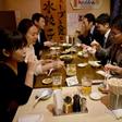 Suntory employees drink at a pub after finishing work at three o'clock in Tokyo, on February 24, 2017
