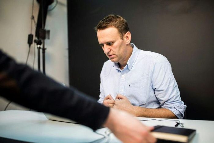 This handout photograph released by 'This Is Navalny Project' shows Russian opposition leader Alexei Navalny in his office in Moscow on July 7, 2017