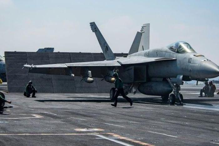 An F/A-18E Super Hornet attached to the "Tomcatters" of Strike Fighter Squadron (VFA) 31 on the deck of the Nimitz-class aircraft carrier USS George H.W. Bush to conduct flight operations in support of Operation Inherent Resolve on June 6, 2017