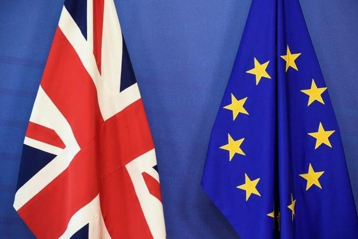 Britain began formal talks with Brussels on Monday to leave the EU