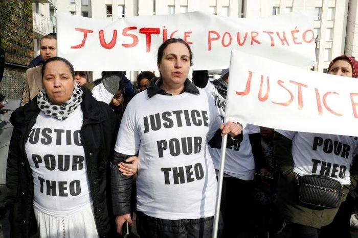 Protesters holding signs calling for "Justice for Theo" march on Monday in the Paris suburb of Aulnay-sous-Bois, referring to the man who was allegedly sodomised during a police arrest last week