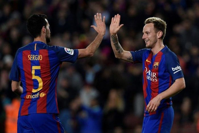 Ivan Rakitic (R) has won eight trophies since joining Barcelona from Sevilla in 2014
