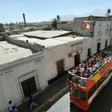 Tourists ride on a sightseeing bus in Arequipa, 1,600 km south of Lima