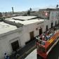 Tourists ride on a sightseeing bus in Arequipa, 1,600 km south of Lima