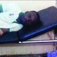 Pastor Alex Ochienu on his hospital bed