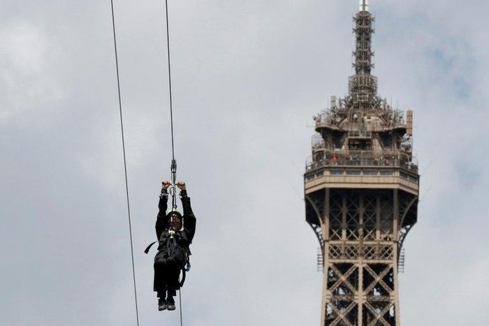 Thrill seekers are leaping from the second floor of Paris's Eiffel Tower on a zipwire to the other end of the Champs de Mars park during the last week of the French Open tennis championships