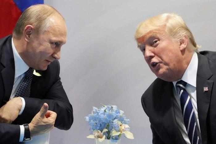US President Donald Trump (right) and Russia's President Vladimir Putin speak on the sidelines of the G20 Summit in Hamburg, Germany, on July 7, 2017