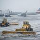 The tarmac of La Guardia Airport is cleared during a winter storm on February 2, 2015 in the Queens borough of New York City.