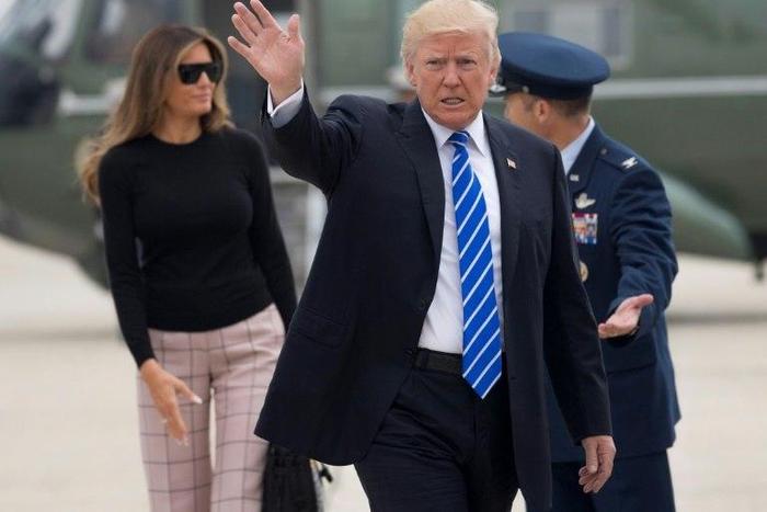 US President Donald Trump and First Lady Melania Trump prepare to board Air Force One at Andrews Air Force Base in Maryland on July 5, 2017