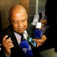 South African finance minister Pravin Gordhan speaks with journalists outside of the High Court on March 28, 2017 in Pretoria