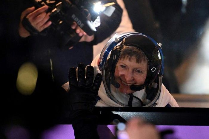 US astronaut Peggy Whitson waves to the crowd at the Russian-leased Baikonur Cosmodrome in November 2016