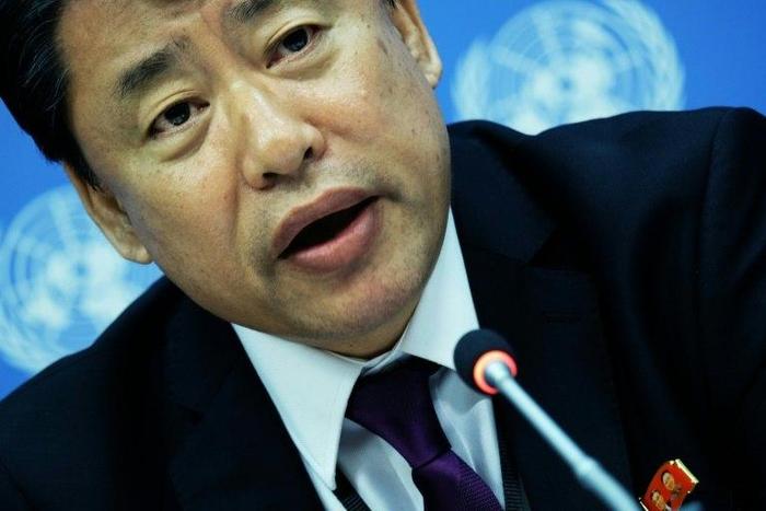 North Korea's deputy UN ambassador Kim In Ryong denies his government is behind cyberattacks while wearing a pin with images of North Korean leader Kim Jong-Un and his late father Kim Kim Jong-il, at the UN headquarters in New York on May 19, 2017.
