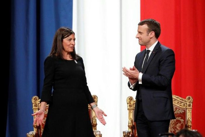 French President Emmanuel Macron (R) told Paris' Mayor Anne Hidalgo, "I'm right with you on your venture for the Olympics, Paralympics and the 2024 objective"