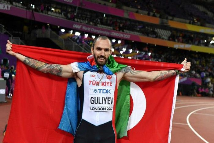 Turkey's Ramil Guliyev celebrates after winning the 200-metres at the world athletics championships in London