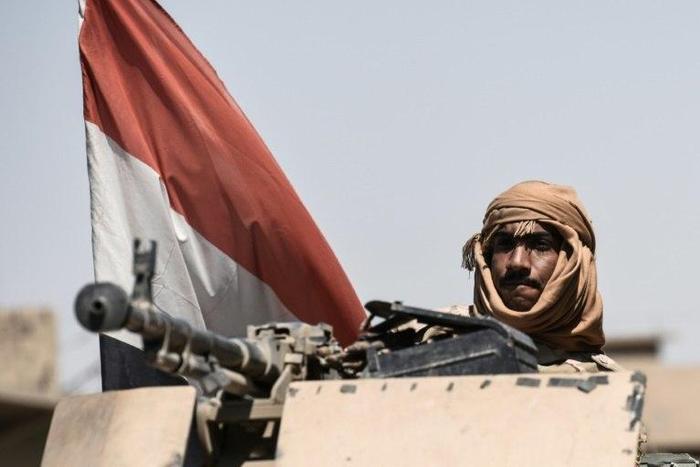 An Iraqi forces member is seen patrolling the area of the industrial zone in Mosul on June 23, 2017