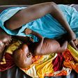 A mother breastfeeds her child suffering from acute malnutrition at a clinic run by Doctors Without Borders (MSF) in Aweil, northern Bahr al-Ghazal, South Sudan