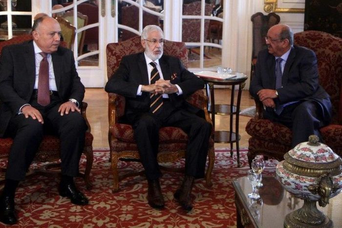 (L-R) Egypt Foreign Minister Sameh Shoukry, Libyan foreign minister Mohamed Tahar Siala and Algerian Minister of Maghreb Affairs, Abdelkader Messahel, chat during a meeting over the turmoil in Libya on January 21, 2017, in the capital Cairo