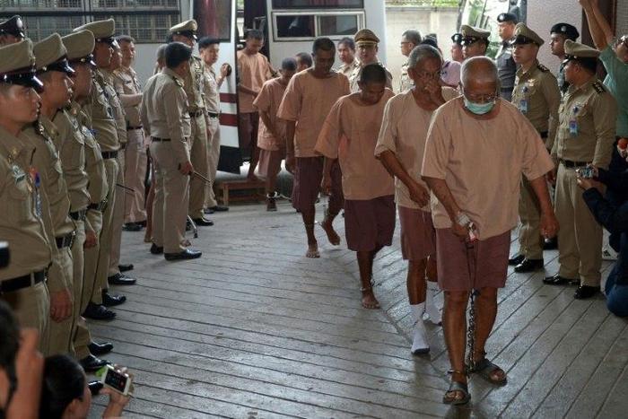 Some of the dozens of people arrested in a crackdown on human trafficking arrive in court to present their defence