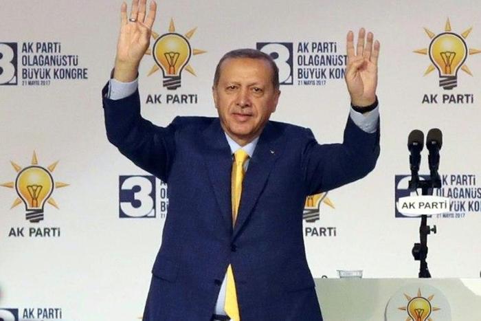 Turkish President Tayyip Erdogan waves to supporters during an extraordinary congress of the ruling AK Party (AKP) in Ankara, on May 21, 2017