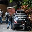 Venezuelan intelligence service members stand guard outside the home of ousted attorney general Luisa Ortega, who says it was raided and searched