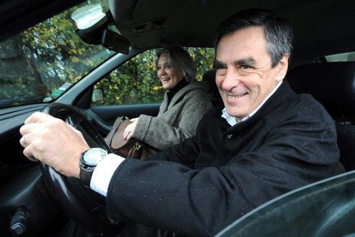 Former French Prime Minister and presidential candidate of right-wing main opposition party UMP Francois Fillon and his wife Penelope Fillon, seen in November 2012, are under fire for claims she was paid 500,000 euros for a fake job