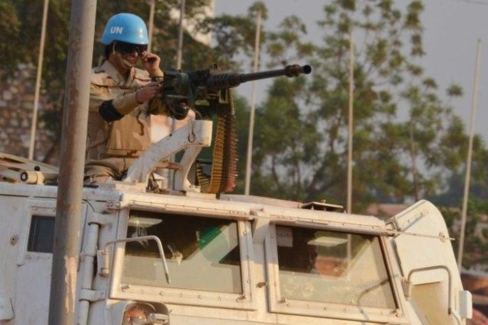 A Moroccan peacekeeper from the United Nations Mission in the Central African Republic (MINUSCA) patrols in Bangui on December 24, 2015 ahead the country presidential elections