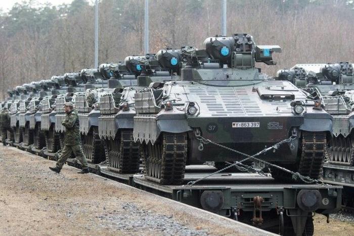Chancellor Angela Merkel says Germany remains committed to raising military spending to two percent of gross domestic product