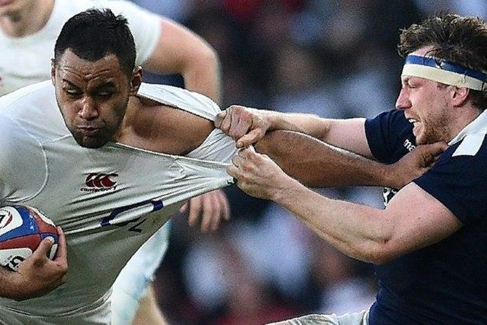 England's Billy Vunipola (L) is tackled as he runs with the ball during the Six Nations international rugby union match against Scotland on March 11, 2017