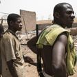 Vigilantes in Kaduna stand guard after an attack by Fulani herdsmen