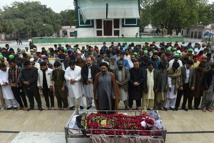 Pakistani relatives and residents offer funeral prayers for a blast victim during a ceremony in Lahore on February 14, 2017